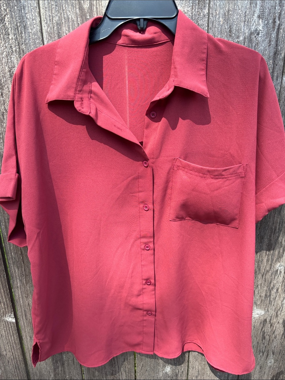 Women’s button down collared single pocket short sleeved shirt